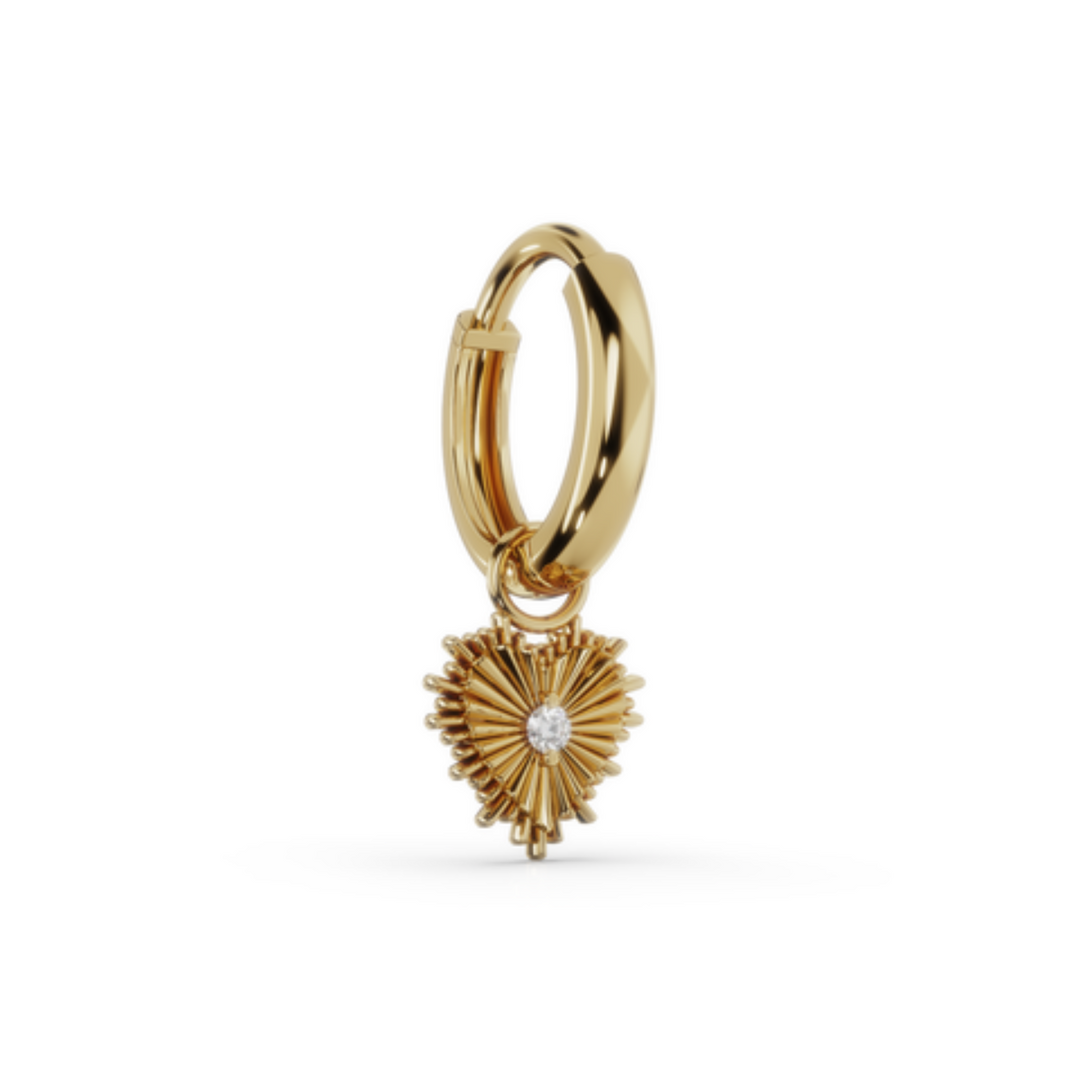 Solid gold huggie earrings close-up detail