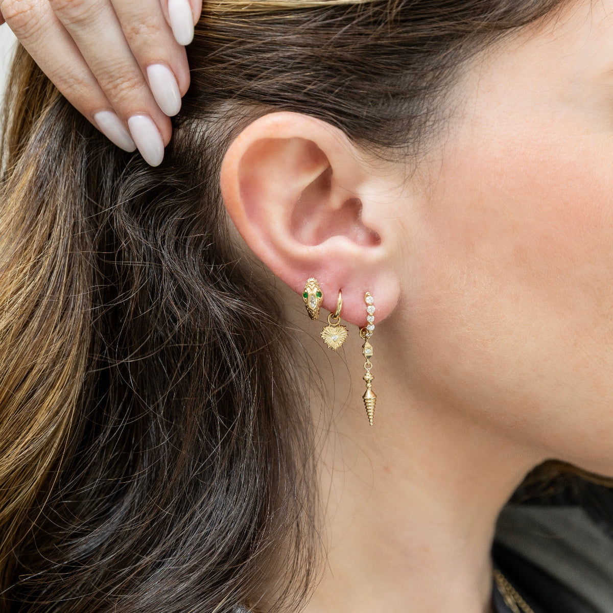 Marquise diamond snake huggie styled on ear