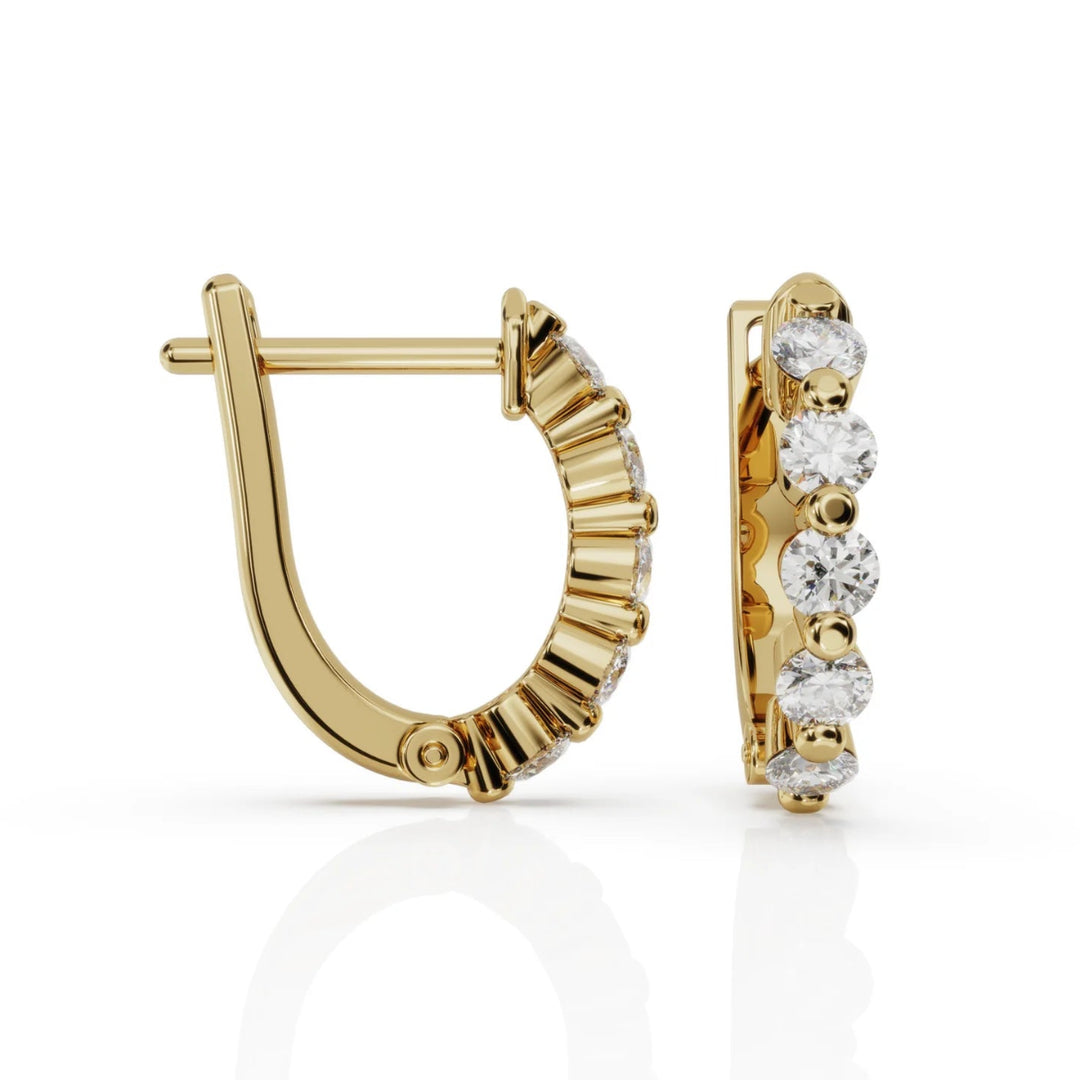Floating diamond huggie earrings in 9ct yellow gold