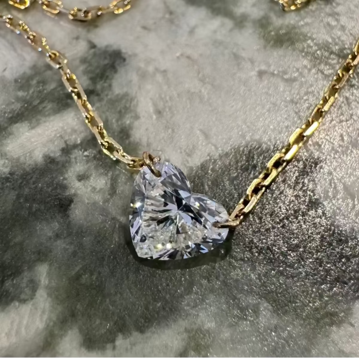 Floating heart diamond necklace in 9ct yellow gold