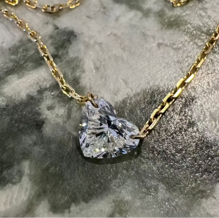 Floating heart diamond necklace in 9ct yellow gold